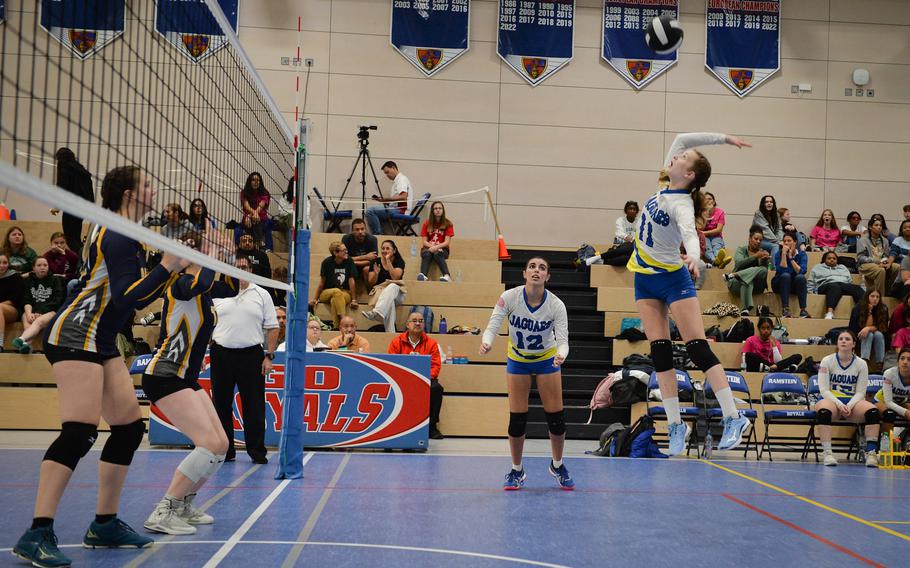 Sigonella’s Isabella Naselli jumps for the ball during the 2022 DODEA-Europe Volleyball Tournament Championship game against Ansbach as her teammate Fabiola Mercado-Rodriguez looks on Oct. 29, 2022, at Ramstein Air Base, Germany. 