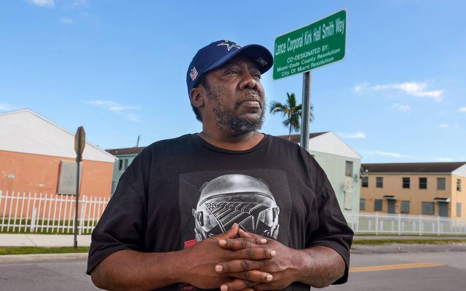 Terrence Smith stands by the street sign in the heart of Liberty Square named after his brother Lance Cpl. Kirk Smith, who was killed in 1983 US Embassy bombing in Beirut. Liberty Square, known also as the Pork-n-Beans, was where the Smith brothers were raised in Miami.