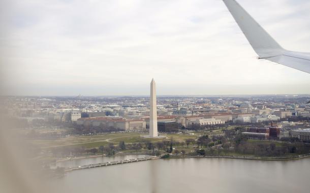 A plane passes the Washington Monument en route to Reagan National Airport in 2020. The airport and the National Mall are less than two miles apart. MUST CREDIT: Bonnie Jo Mount/The Washington Post