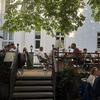 Diners enjoy the shade of the more than 170-year-old chestnut trees at Zum Goldstein in Mainz, Germany.