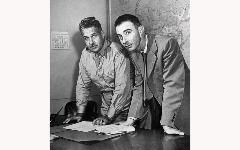 Army Gen. Leslie R. Groves, military head of the Manhattan Project, stands beside Professor Robert Oppenheimer in 1942.