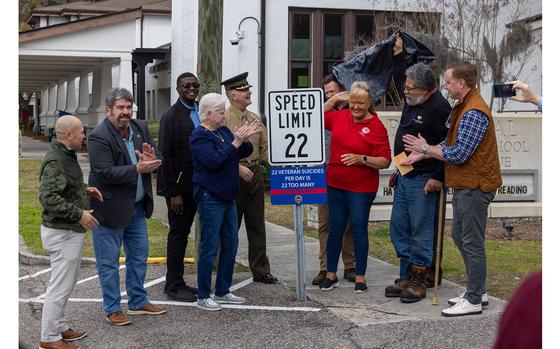 Key military and local community leaders gathered to unveil a new “22” mph speed limit sign in Port Royal, S.C., Feb. 23, 2024. The sign aims to bring awareness to veteran mental health issues and the resources available to those in the community. 