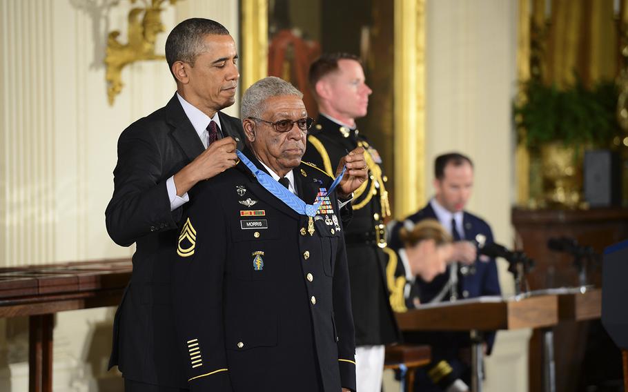 Then-President Barack Obama presents the Medal of Honor to Sgt. 1st Class Melvin Morris at the White House in Washington D.C., on March 18, 2014.  Morris was recognized for his courageous actions Sept. 17, 1969 while serving in Vietnam.