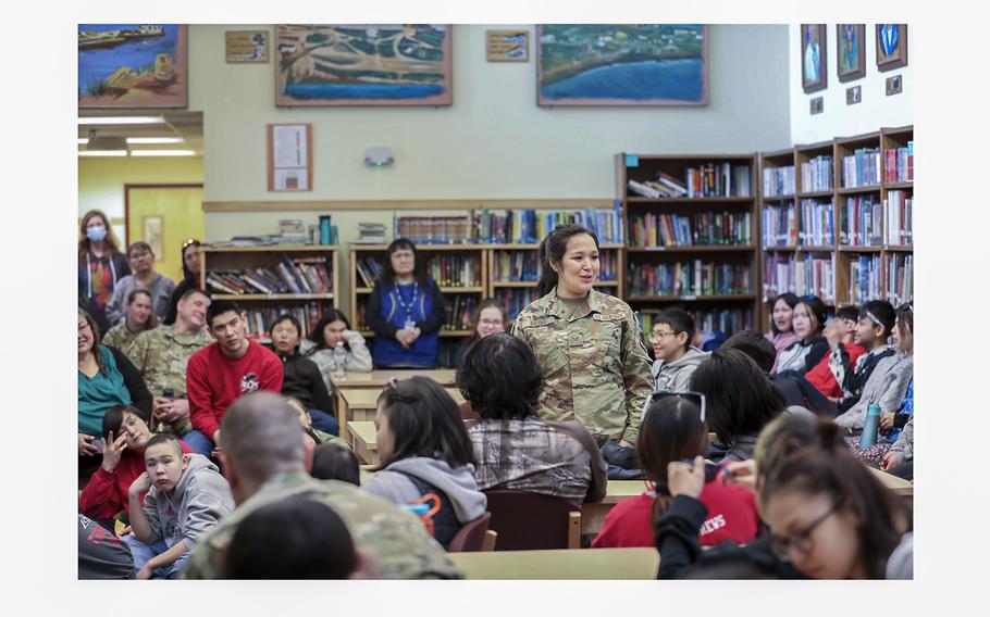 Alaska Air National Guard Staff Sgt. Sharon Queenie with the 176th Air Defense Squadron speaks to students from her hometown of St. Mary’s, Alaska, during a recruiting initiative at Andreafski High School, March 31, 2023. Queenie is one of several guard members slated to have their personnel status changed to technician status, which will cut her pay by about 50%. 