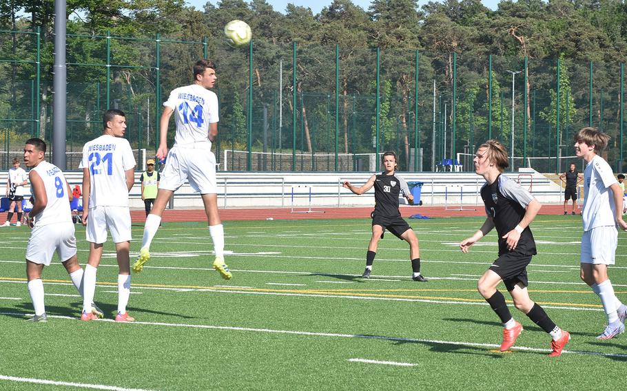 A free kick from Stuttgart's Itzak Sandoval clears its way over a wall of Wiesbaden defenders Wednesday, May 18, 2022, but it hit the crossbar in a DODEA-Europe boys Division I semifinal game at Ramstein Air Base, Germany.