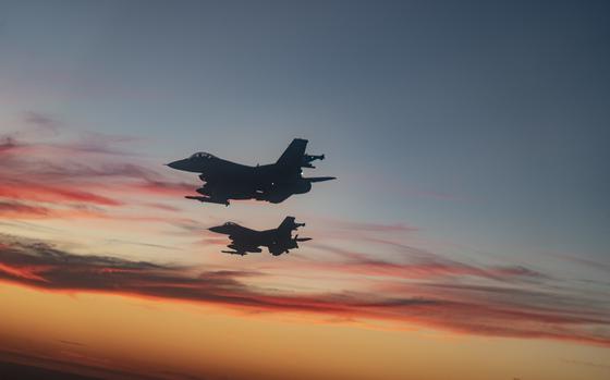 F-16 Fighting Falcons from Eglin Air Force Base fly over a high school football game in Niceville, Fla., Sept. 24, 2021.  The Okaloosa County Schools held a Prisoner of War/Missing In Action remembrance ceremony prior to kick-off.  (U.S. Air Force photo by Master Sgt. Tristan McIntire)