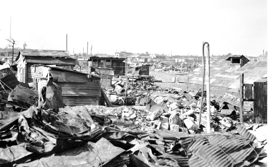 In this Sept. 7, 1945, file photo, makeshift housing built from galvanized iron roofing of burned buildings stands amid destruction and rubble in Tokyo. Katsumoto Saotome, a Japanese writer who gathered the accounts of survivors of the U.S. firebombing of Tokyo in World War II to raise awareness of the massive civilian deaths and the importance of peace, has died. He was 90.