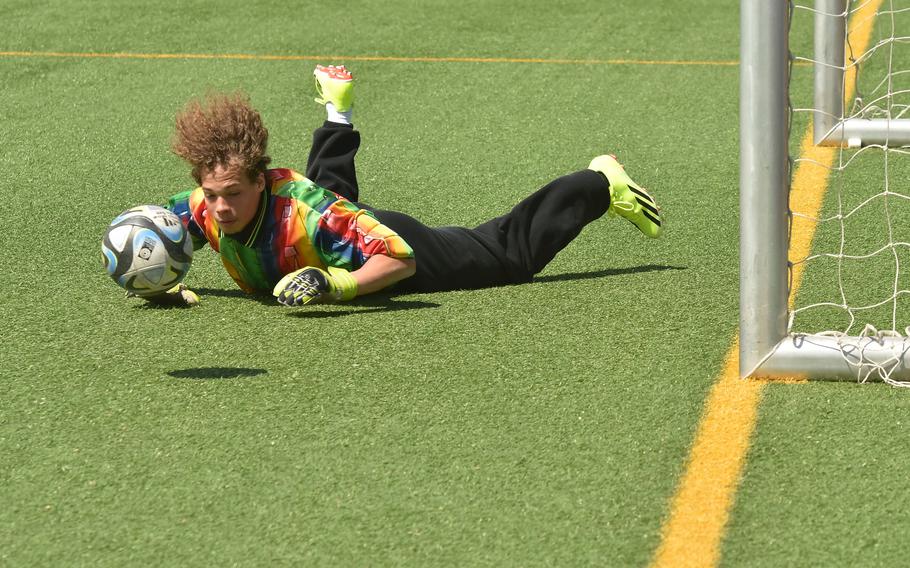 Vilseck goalie Jackson Kerin dives for a save during a game against Wiesbaden on May 4, 2024, in Wiesbaden, Germany.