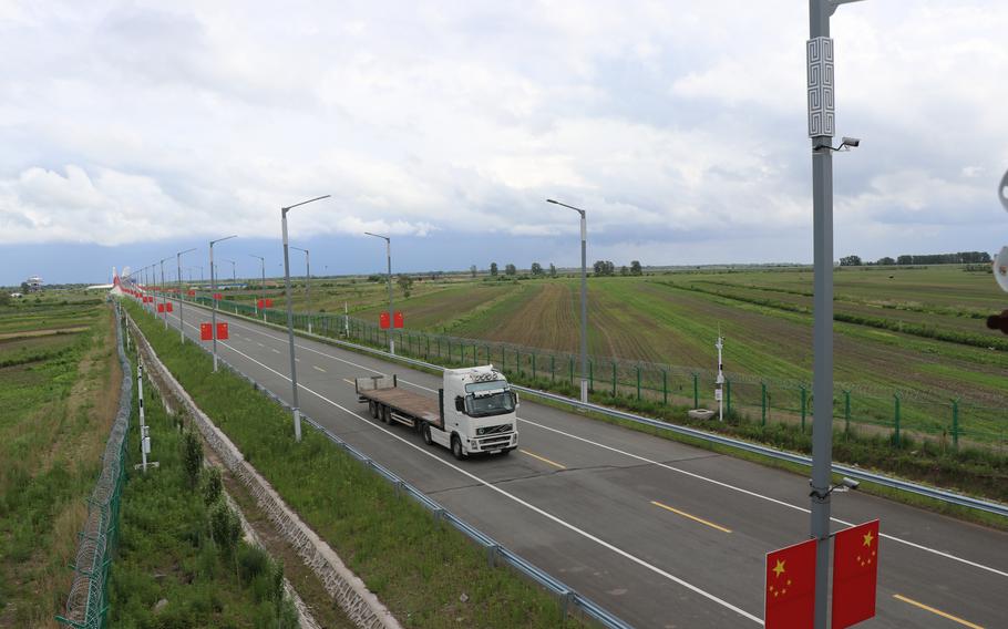 A truck drives from Blagoveshchensk, Russia, to Heihe, China, over the first highway bridge between the two countries on June 16, 2022. The bridge was opened on June 10, 2022, after a more than two-year delay. 