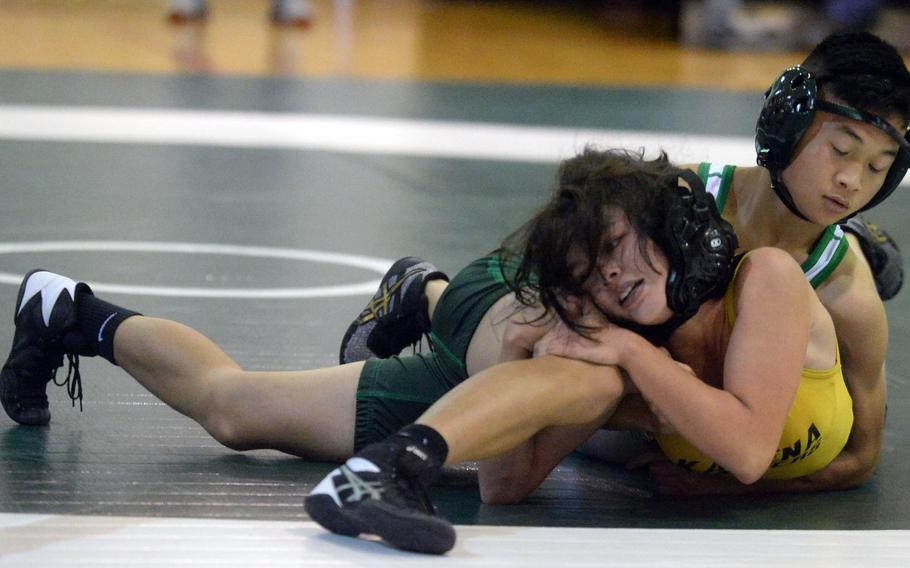 Kubasaki's Gavin Ocampo gains the upper hand on Kadena's Mylein Tull during the 108-pound bout in Wednesday's Okinawa wrestling dual meet. Ocampo pinned Tull in 4 minutes, 21 seconds and the Dragons won the dual meet 37-25.