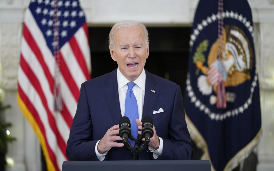 President Joe Biden speaks about the coronavirus response and vaccinations, Tuesday, Dec. 21, 2021, in the State Dining Room of the White House in Washington.