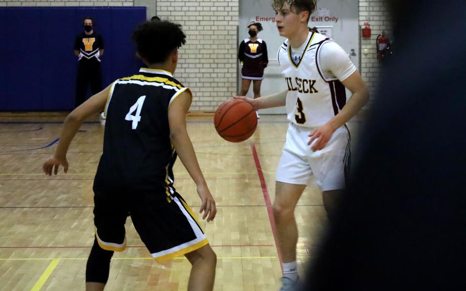 Vilseck’s Noah Russo, right, is guarded by a Stuttgart player in a home game Jan. 7, 2022. Days after announcing that students must be vaccinated to travel to and from school activities, DODEA-Europe announced an exception. Students can now request permission to arrange their own transportation for school functions.