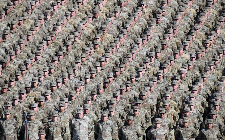 Thousands of U.S. soldiers stand in formation.