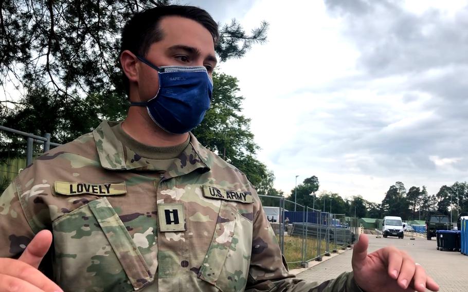 Army Capt. Alex Lovely stands at the site on Rhine Ordnance Barracks in Kaiserslautern, Germany, on Aug. 30, 2021, where more facilities are being installed to take in an additional 3,000 Afghan evacuees. The Army has already provided shelter for more than 3,000 evacuees at the site, to ease the burden on Ramstein Air Base, where some 24,000 Afghans have arrived since mid-August.