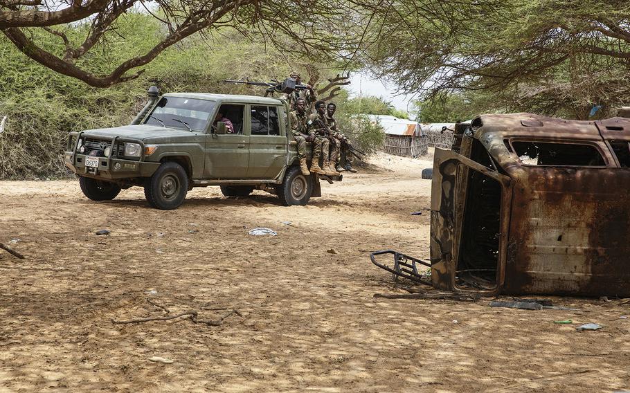 A Danab vehicle drives through town in Masjid Ali Guduud that was recently taken back from al-Shabab control in Somalia. 