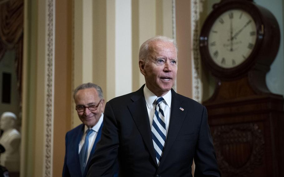 President Joe Biden speaks to members of the media with Senate Majority Leader Chuck Schumer, D-N.Y., at the U.S. Capitol in Washington, D.C., on July 14.