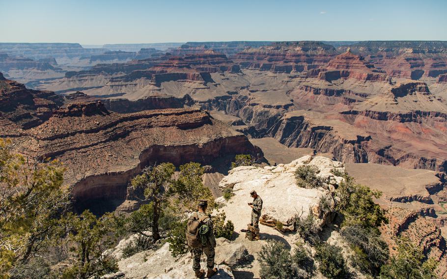 Marine Staff Sgt. Coltin Davenport, regimental communications chief, right, and Cpl. Owen Trinidad, a field radio operator, set up a radio antenna in the Grand Canyon, near Grand Canyon Village, Ariz., May 14, 2021. Marines with the 2nd Transportation Battalion, Combat Logistics Regiment 2, 2nd Marine Logistics Group drove from Camp Lejeune, N.C., to Twentynine Palms, Calif., in one of the longest convoys in the service's history.