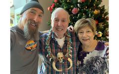 Mike Gabler with his parents, Bob and Joan Gabler, while watching the final episode of the reality TV show “Survivor,” on Dec. 14, 2022. Mike Gabler won the show’s $1 million prize and pledged to donate the money to veterans charities in honor of his father, a former Army Green Beret.