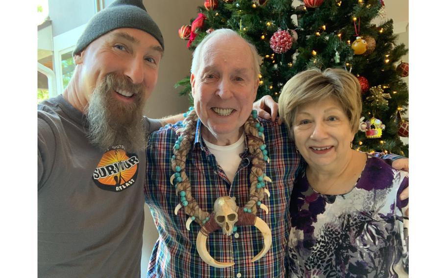 Mike Gabler with his parents, Bob and Joan Gabler, while watching the final episode of the reality TV show “Survivor,” on Dec. 14, 2022. Mike Gabler won the show’s $1 million prize and pledged to donate the money to veterans charities in honor of his father, a former Army Green Beret.