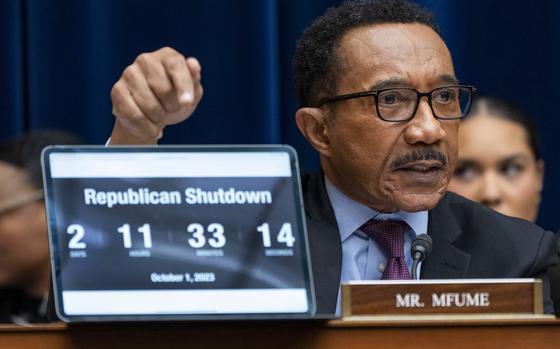 Rep. Kweisi Mfume, D-Md., points to a countdown clock with the time left before a government shutdown, during a House Oversight Committee impeachment inquiry into President Joe Biden, Thursday, Sept. 28, 2023, on Capitol Hill in Washington. (AP Photo/Jacquelyn Martin)