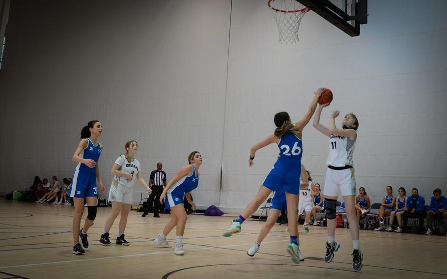 Marymount’s Ludovica Nati blocks a shot by Vicenza’s Laurel Gill during the DODEA-Europe Division II girls basketball tournament at Ramstein Air Base, Germany, Feb. 15, 2023. 