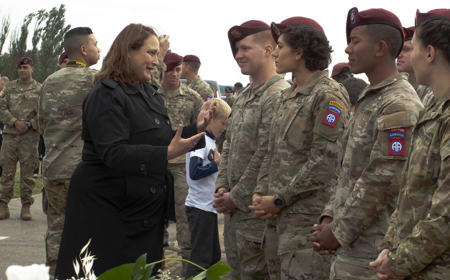 U.S. Embassy charge d'affaires Marja Verloop speaks with 82nd Airborne Division soldiers after a ceremony on Sept. 20, 2021, in Nijmegen, Netherlands, to mark the 77th anniversary of the Waal River crossing by U.S. paratroopers.