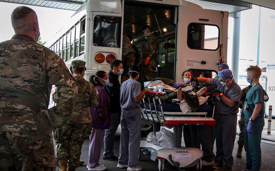 Staff at Landstuhl Regional Medical Center receive casualties Aug. 27, 2021, who were medically evacuated from Kabul, Afghanistan, after an attack outside of Hamid Karzai International Airport in Kabul a day earlier and evacuated to LRMC.