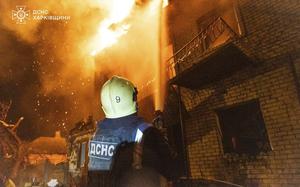 In this photo provided by the Ukrainian Emergency Service, emergency services personnel work to extinguish a fire following a Russian attack in Kharkiv, Ukraine, Wednesday, April 30, 2025. (Ukrainian Emergency Service via AP)