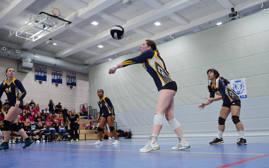 Trinity Batin of the Ansbach Cougars sets the ball during the 2022 DODEA-Europe Volleyball Tournament Oct. 29, 2022, at Ramstein Air Base, Germany.