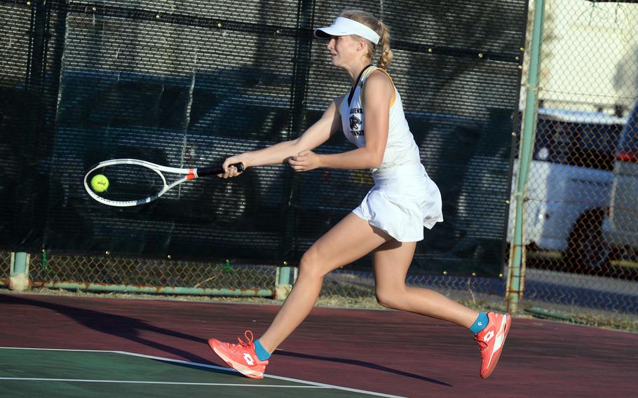 Kadena's Brooke Brewer races forward to hit a forehand return.