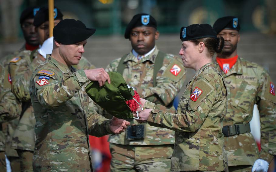 Command Sgt. Maj. Luis Ortiz-Escalera, left, uncases the unit colors with Lt. Col. Robin A. Eskelson, after she assumed command of the reactivated 95th Combat Sustainment Support Battalion, April 6, 2023, during a ceremony at Smith Barracks in Baumholder, Germany.