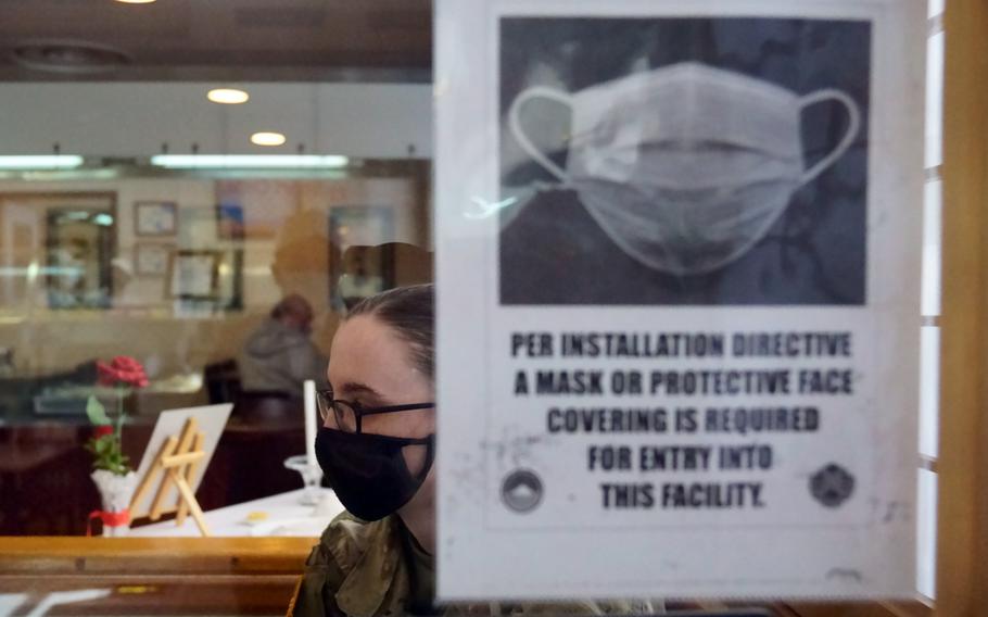 Army Pfc. Mary Simon wears a mask earlier this month while working at a dining facility on Camp Zama, Japan.