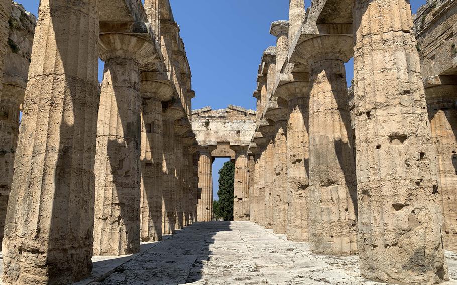 Visitors can enter and explore the Temple of Neptune, one of three temples in the Paestum ruins in Italy. 