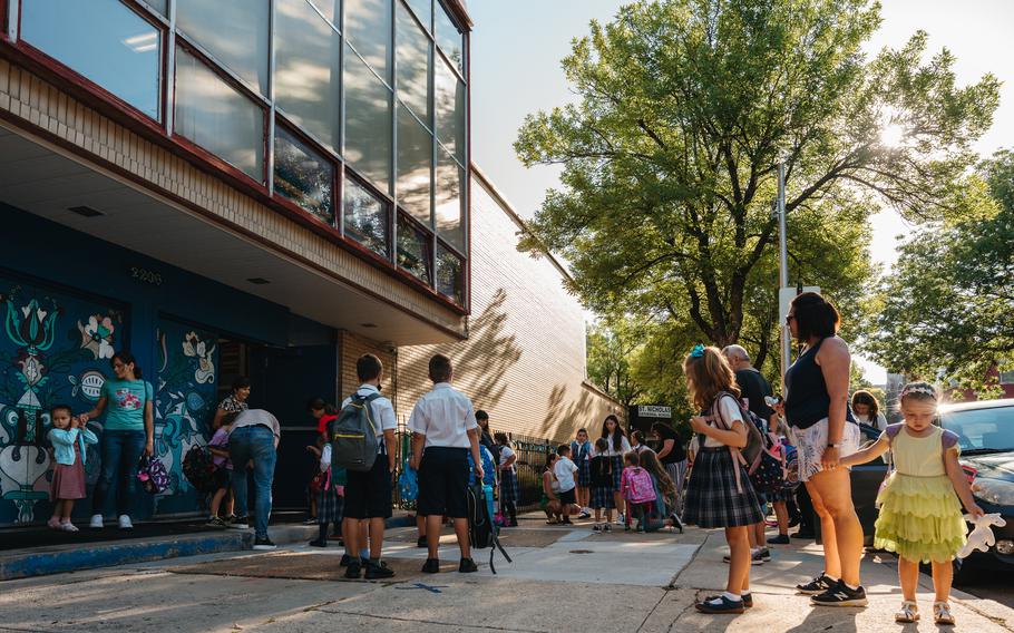 Students arrive at St. Nicholas Cathedral School in Chicago's Ukrainian Village neighborhood. 