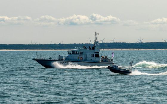 The British navy patrol vessel HMS Pursuer conducts operations in the Baltic Sea with an autonomous reconnaissance craft from Task Force 66 during the BALTOPS exercise June 12, 2025.