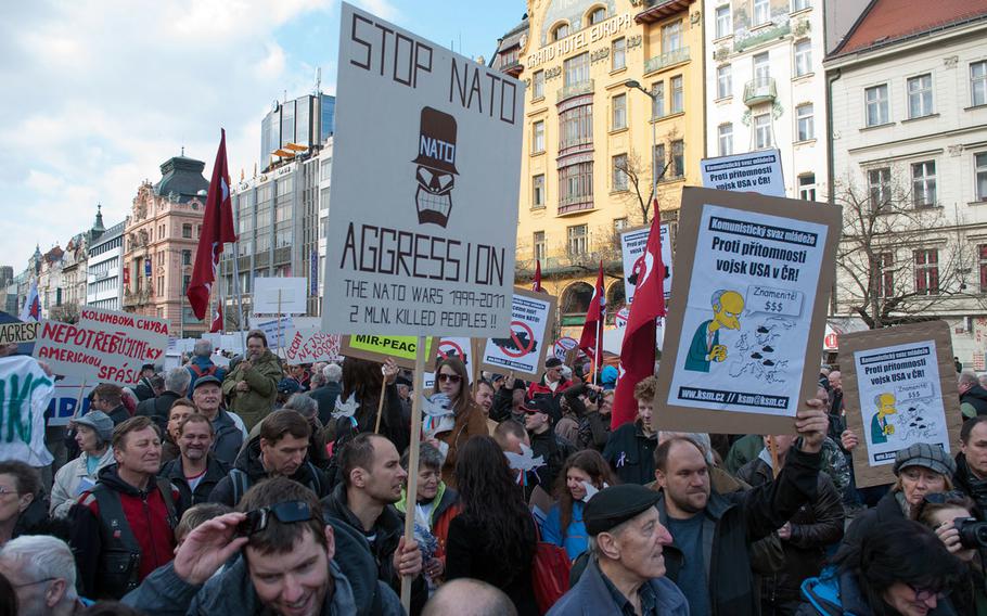 Czechs protest against NATO and the U.S. in Prague in 2015. International attitudes to the U.S. and NATO have improved since the beginning of the war in Ukraine, according to a new Pew Research Center global opinion survey. 
