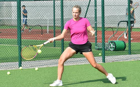 Stella Schmitz stretches out during a practice on Aug. 30, 2023, at Kaiserslautern High School in Kaiserslautern, Germany. The Raider junior is looking to defend her DODEA European girls singles title this fall.