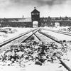 FILE- This February/March 1945, file photo shows the entry to the concentration camp Auschwitz-Birkenau in Poland, with snow covered rail tracks leading to the camp. Israel is hoping the U.N. General Assembly will unanimously adopt a resolution rejecting and condemning any denial of the Holocaust and urging all nations and social media companies “to take active measures to combat antisemitism and Holocaust denial or distortion.” The 193-member world body is scheduled to vote Thursday, Jan. 20, 2022, on the resolution, which is strongly supported by Germany. (AP Photo/Stanislaw Mucha, File)