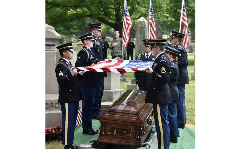 A U.S. military honor guard renders final honors