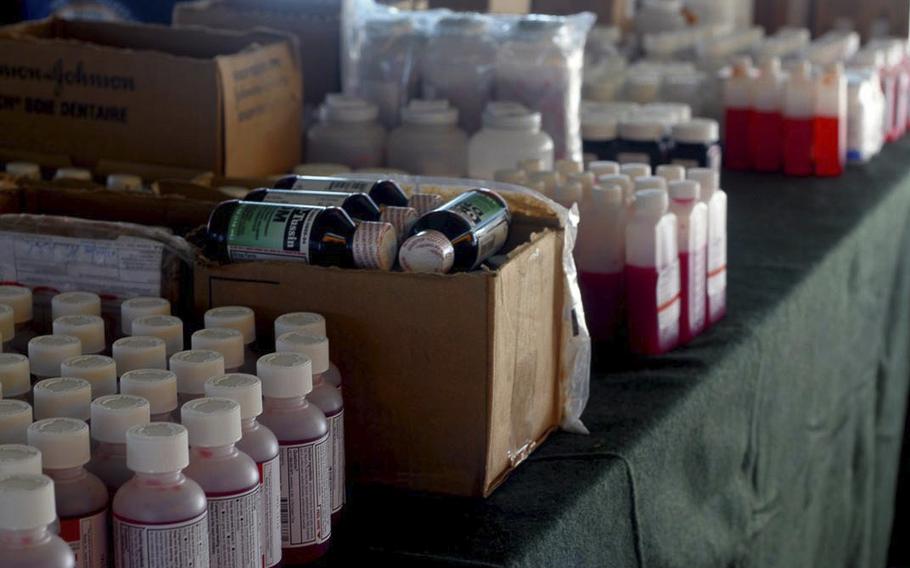 Medicines and first aid treatment supplies line the table of a temporary pharmacy set-up at a school in Malaysia on July 10,2018, during a military exercise.  