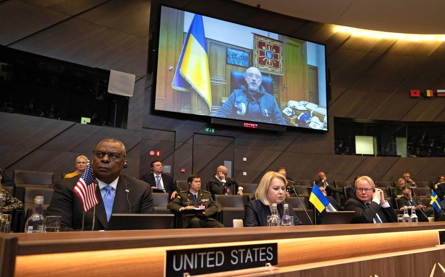 From left, Defense Secretary Lloyd Austin, Natalia Galibarenko, the head of the mission of Ukraine to NATO, and Swedish Defense Minister Peter Hultqvist listen as Oleksii Reznikov, the Ukrainian defense minister, speaks remotely to the extraordinary meeting of NATO defense ministers in Brussels, March 16, 2022.