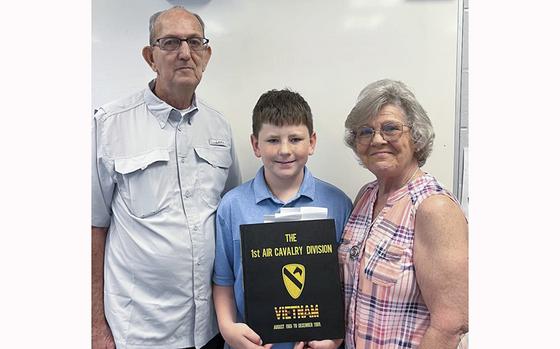 Vietnam War veteran Luke Wolfe and his wife Linda stand beside their grandson Brayden Seal, after Wolfe spoke to Seal’s 6th grade social studies classes about his experiences as a combat photographer for the Army during his tour in Vietnam. 