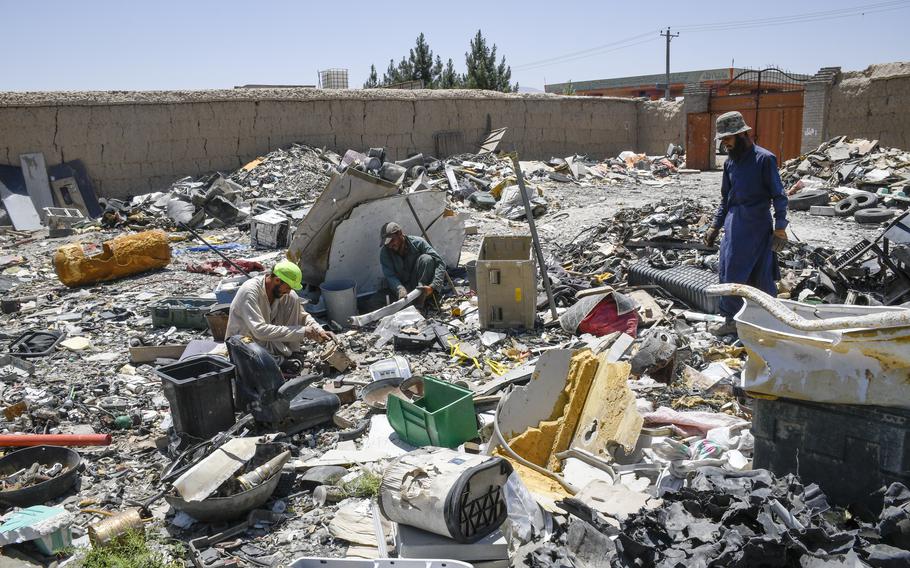 Workers at trash yards near Bagram Airfield, Afghanistan pick through garbage from the base June 5, 2021. While many of the items leaving the base have been crushed or ruined, some have copper or iron that can be recycled and resold. 