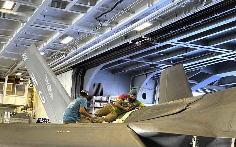 Mechanics work on an F-35.