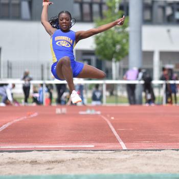Rickalia Goss jumps to a title.