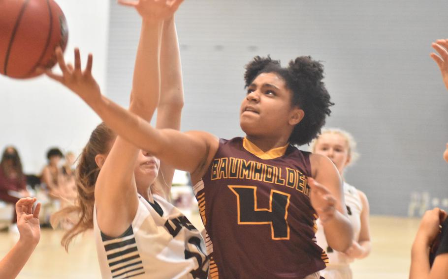 Baumholder's Eileen Sanders tries a scoop shot while playing AFNORTH on Friday, Feb. 25, 2022, at the DODEA-Europe Division III basketball championships.