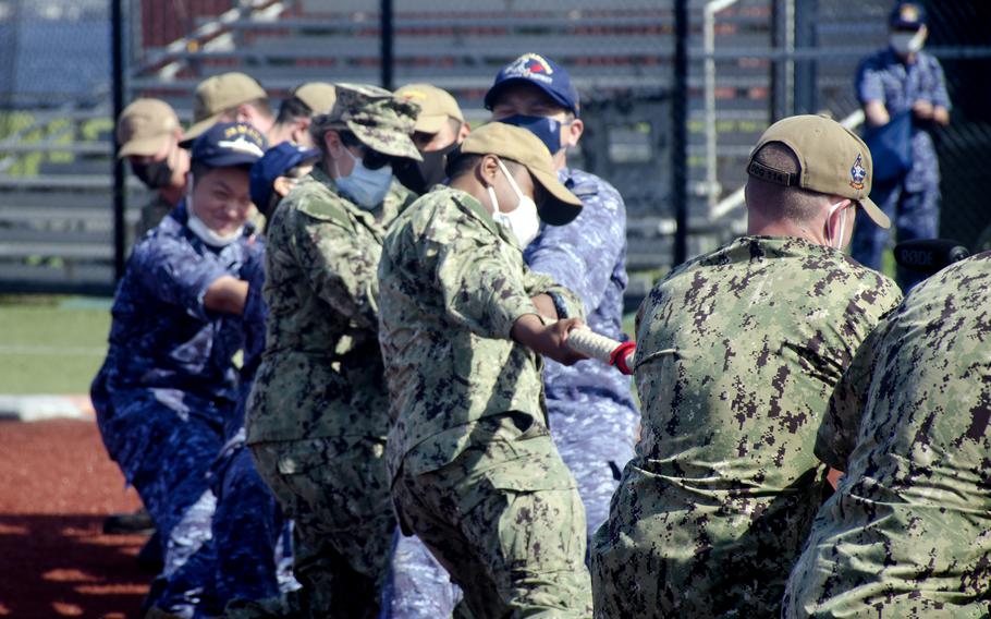 U.S. and Japanese sailors compete in a tug-of-war competition during Fleet Week Japan at Yokosuka Naval Base, May 25, 2022.