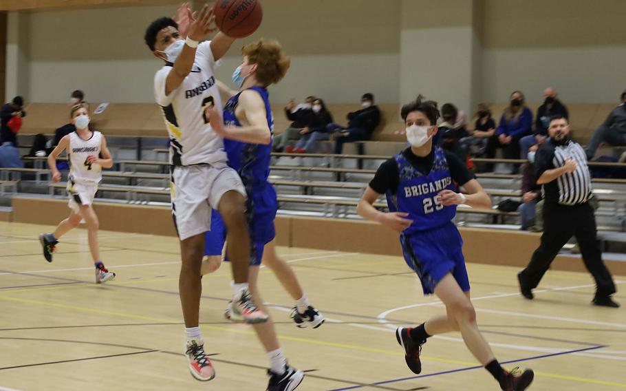 Ansbach's Shane Nesbitt collides with Brussels' Cade Wedekind during a game against Brussels at Ansbach, Germany, on Friday, Feb. 4, 2022.