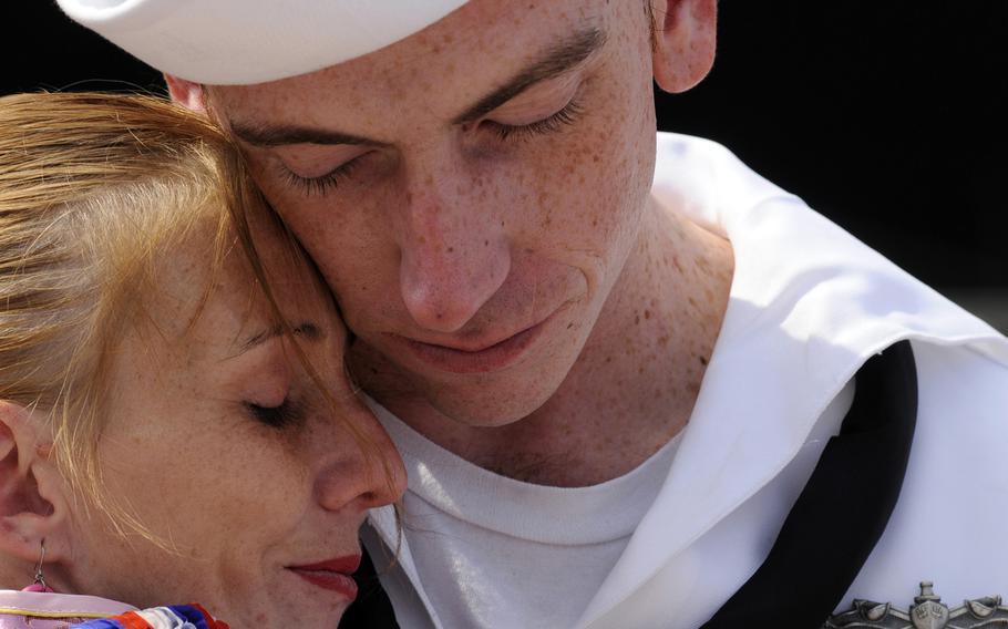 It is routine for people to gather pier side when ships return from long deployments, both to welcome sailors back and help families transition.