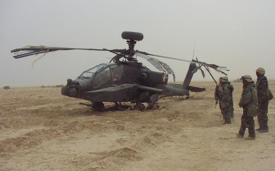 Baghdad, Iraq, Mar. 24, 2003: The Apache Longbow from the 6th Squadron, 6th Cavalry Regiment, was badly damaged in a hard landing before Sunday night's raid near Baghdad, Iraq. Every aircraft that returned had been shot by Iraqi forces. 
             
Read the story on the first battle of the Longbow's of the 6th Squadron, 6th Cavalry Regiment here. 
https://www.stripes.com/news/copters-met-heavy-fire-near-baghdad-1.3439

META TAGS: Operation Iraqi Freedom; War on Terror; U.S. Army; helicopter